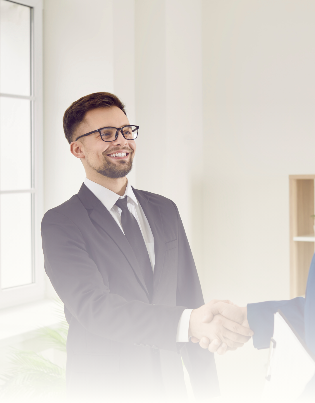 happy lawyer in office shaking hands with client after successful debt recovery